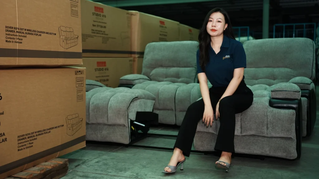 Kim Chi, Product Assistant at theShaper, presenting standardized upholstered sofa collections at TaiYu Sofa factory in Vietnam.