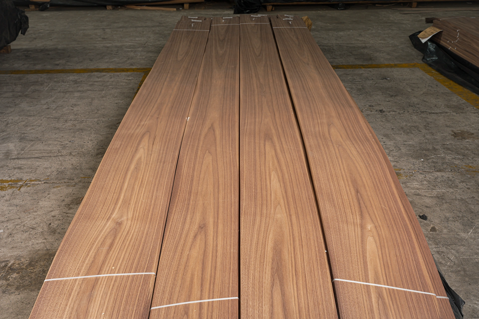 Export-ready pallet packaging of premium Crown Cut American Black Walnut veneer sheet stacks at theShaper manufacturing facility.