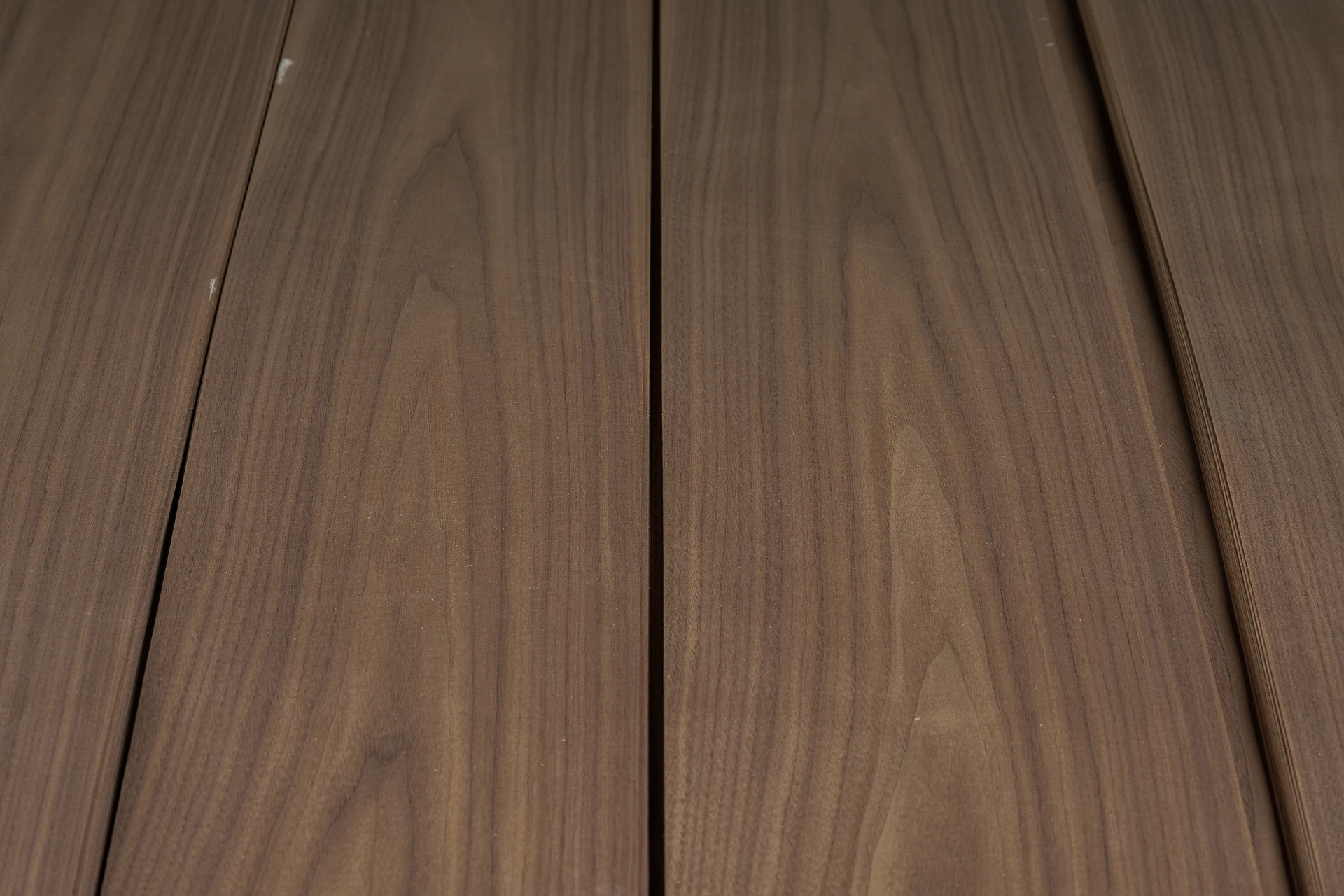 A complete single bundle of natural American Black Walnut crown cut veneer sheets showing consistent grain sequence.