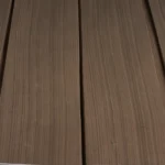 Close-up with shallow depth of field showing the clean Rift Cut Black Walnut veneer linear grain by theShaper.