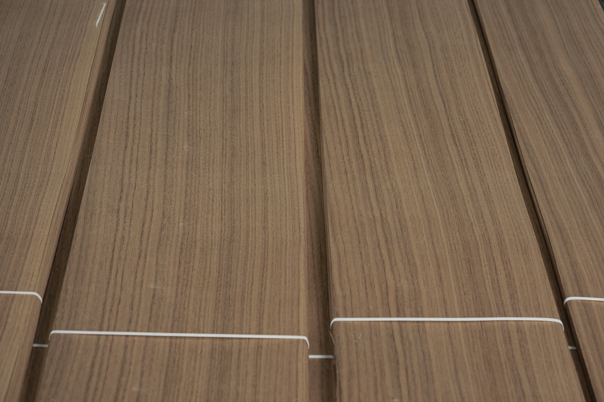 Symmetrical Rift Cut American Black Walnut veneer bundles by theShaper, showing aligned, tight linear grain.