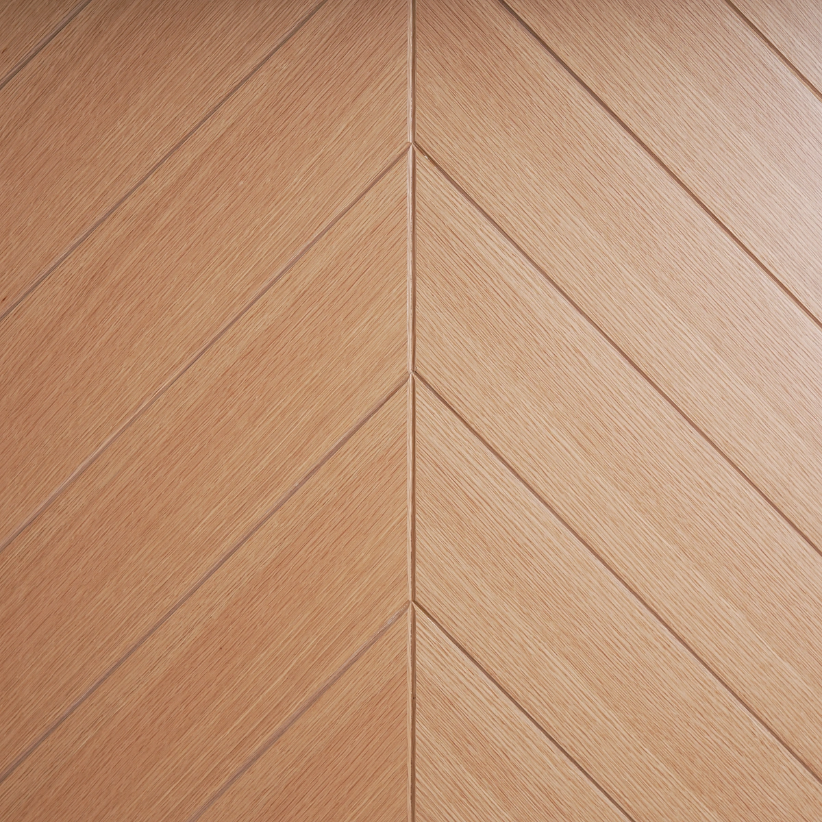 Extreme close-up of the Chevron Matched White Oak door profile edge detailing the seamless veneer wrapping and tight seam joints.