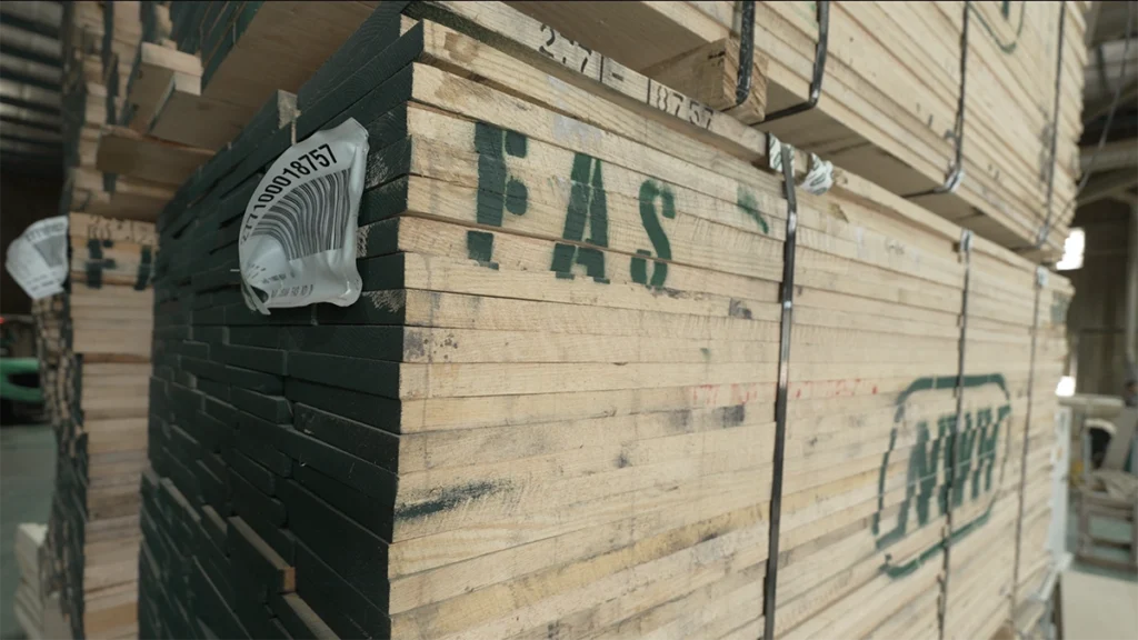 Bundle of premium FAS grade 4/4 North American White Oak lumber sourced from Ohio, prepared as raw material for high-end architectural wood door manufacturing.