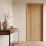 A close-up square shot of a modernist reeded slab door, highlighting the vertical fluted wood texture.