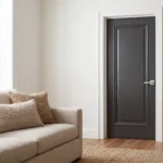 A premium interior composite wood door in a sleek matte black finish with a raised panel design.