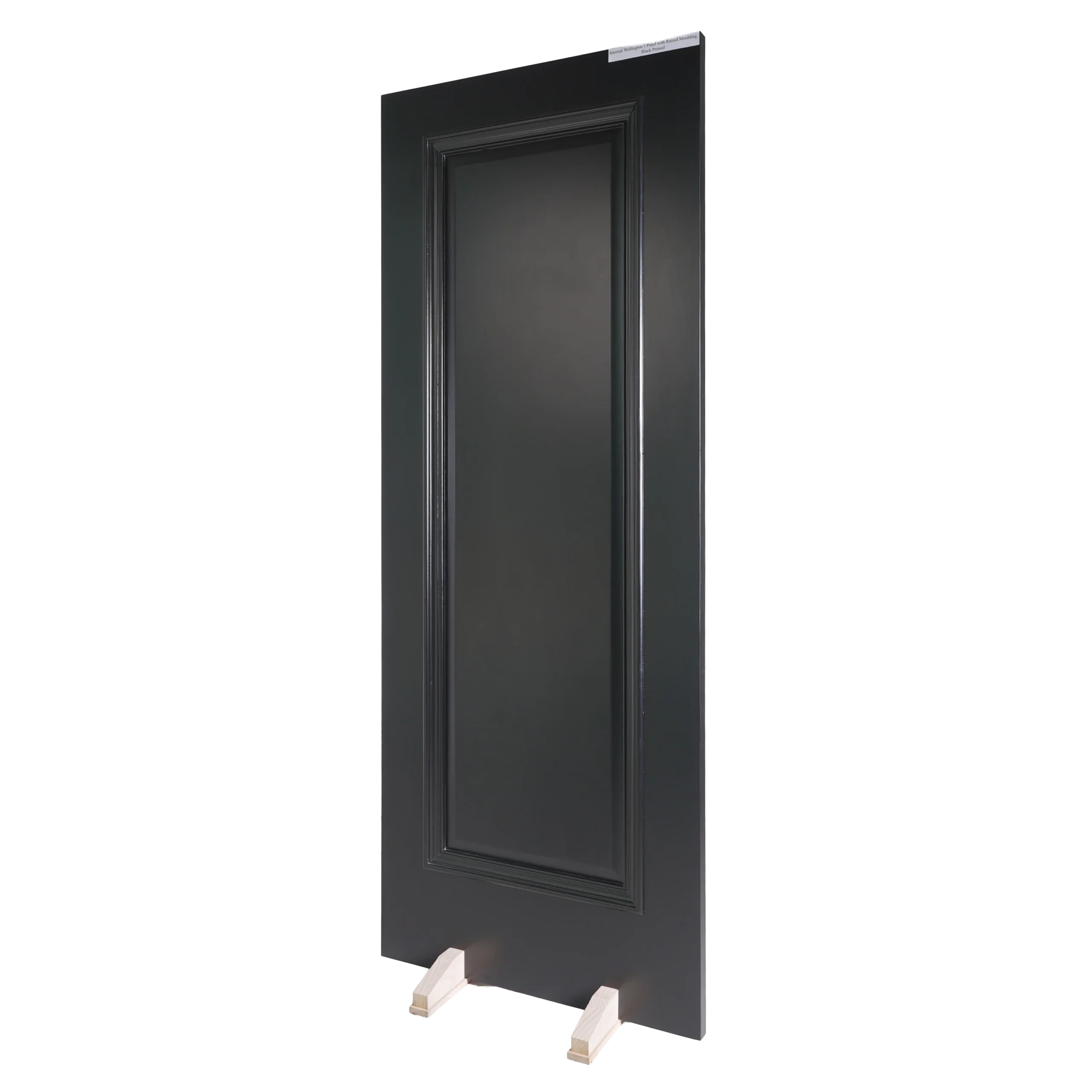 A 30-degree angle view of the Raised Panel Matt Black composited wood door highlighting the dimensional profile depth and matte shadows.