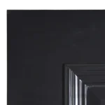 Macro detail of the Raised Panel Matt Black composited wood door profile showing the precision routing and edge craftsmanship.
