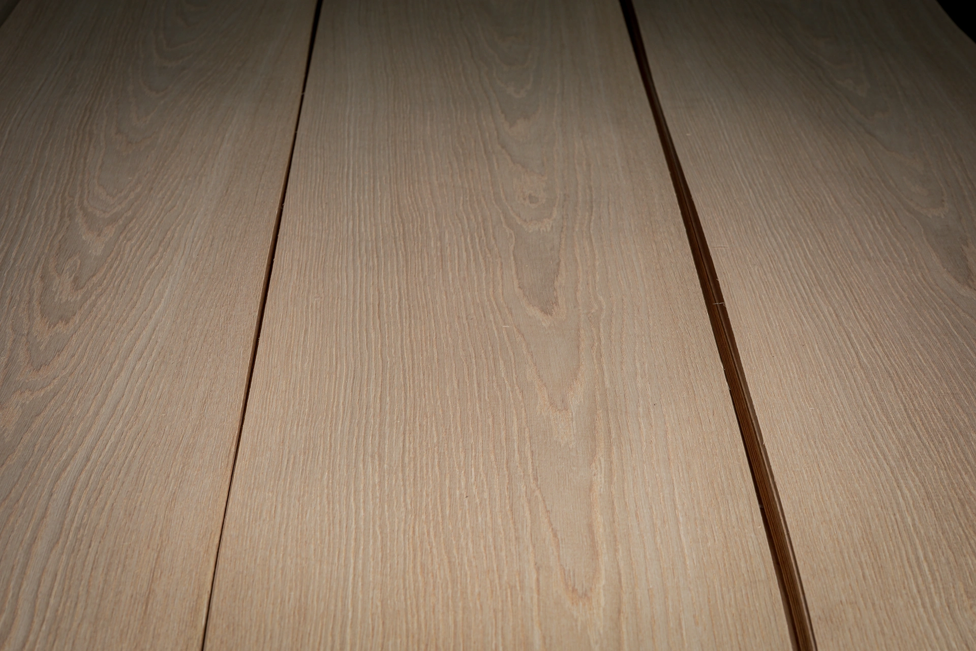 Close-up angle showing the smooth sliced surface and 0.5mm thickness consistency of Crown Cut White Oak Veneer by theShaper.