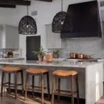 A modern American kitchen interior featuring a full suite of theShaper framed cabinets in Light French Gray with a matching island and solid wood details. 1:1
