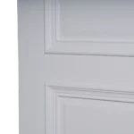 A 30-degree angle view of the White Raised Panel composited wood door highlighting soft lighting transitions on the white painted surface.