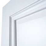 Close-up of projecting bolection moulding shadow reveal under directional lighting in Dover White