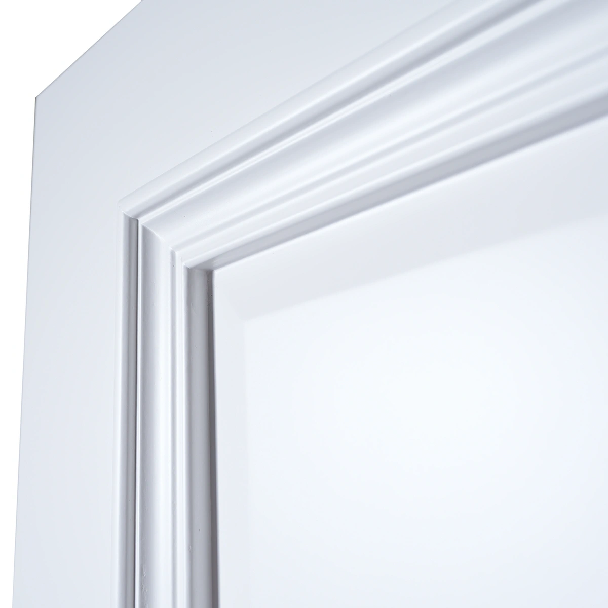 Close-up of projecting bolection moulding shadow reveal under directional lighting in Dover White