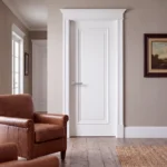 1-Panel Bolection Moulding solid interior door in smooth Dover White finish installed in an elegant contemporary living room