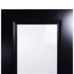 Close-up of tempered safety glass reveal against deep Midnight Iron timber frame