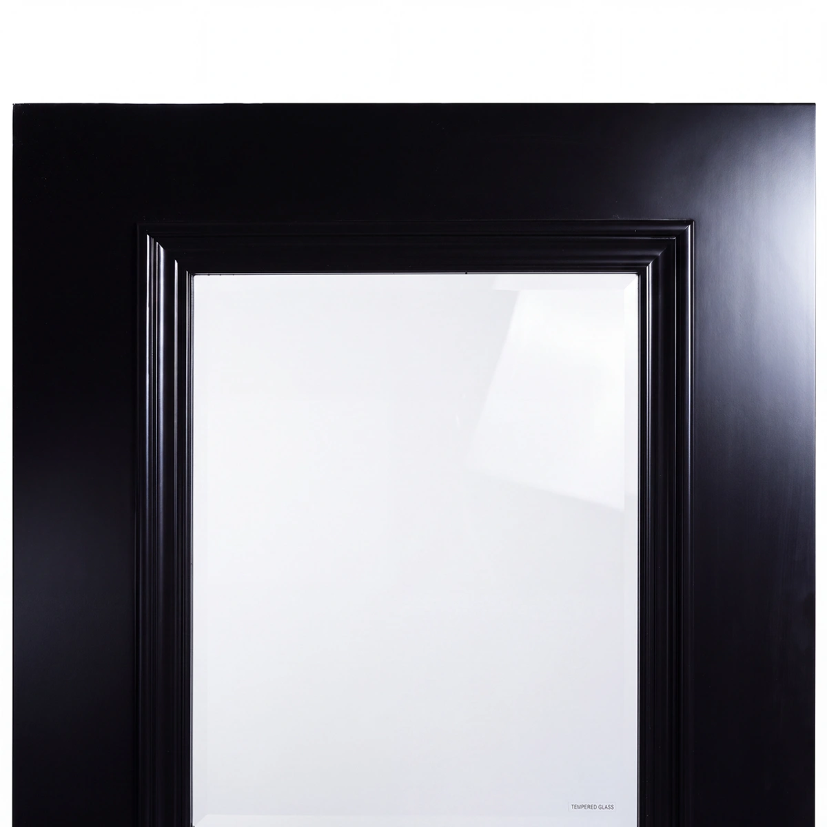 Close-up of tempered safety glass reveal against deep Midnight Iron timber frame