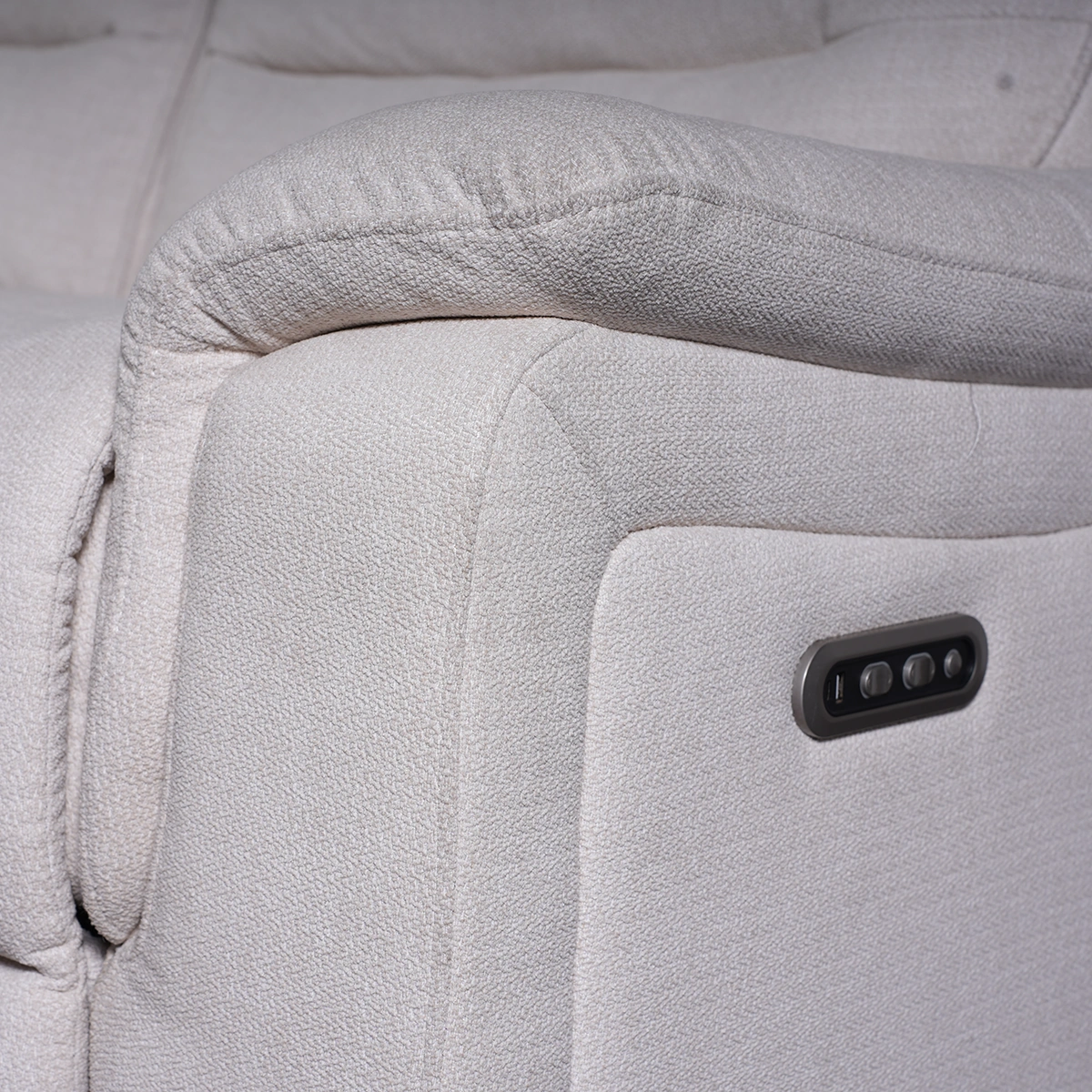 Close-up of side power control buttons with integrated fast-charging USB port.