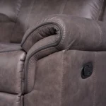 Close-up of exterior manual reclining pull latch handle on side panel of sofa.