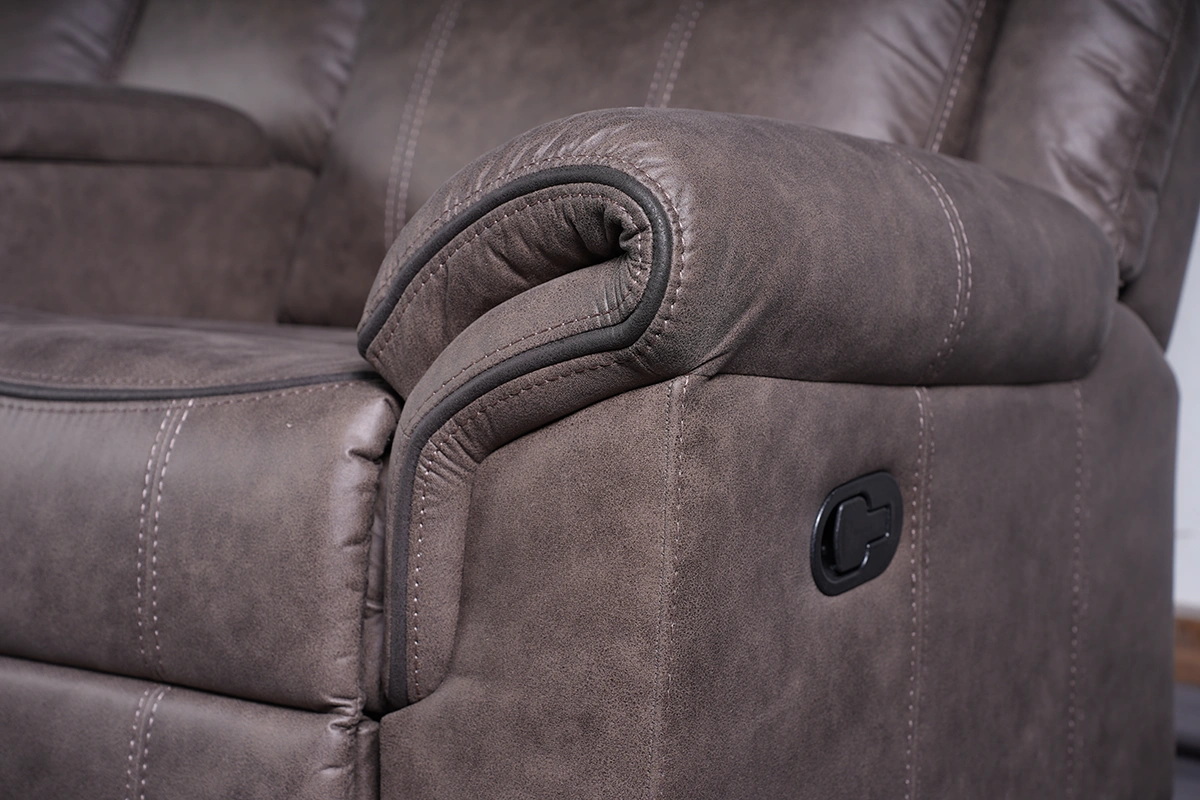 Close-up of exterior manual reclining pull latch handle on side panel of sofa.
