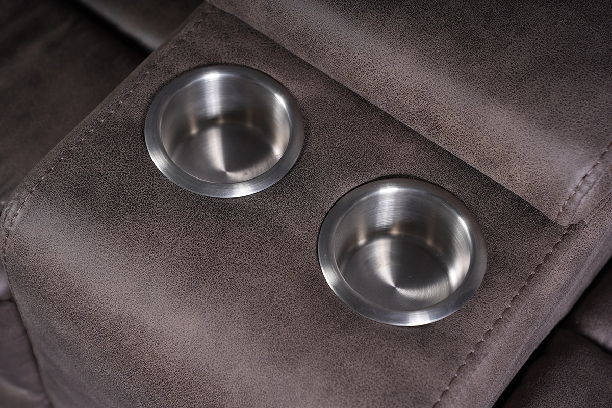 Close-up detail of built-in stainless steel drink holders on Bradford loveseat console.