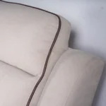 Close-up of plush segmented backrest cushion providing cervical and lumbar support.