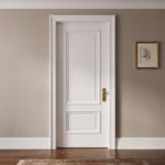 Classic 2-Panel Bolection Moulding door in Dover White installed in an elegant Parisian-style corridor