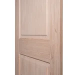 Macro close-up of Shaker intermediate rail and raised pine panel bevel transition
