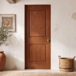 Classic 2-Panel Raised Panel pine interior door stained in warm rich Chestnut in a traditional library