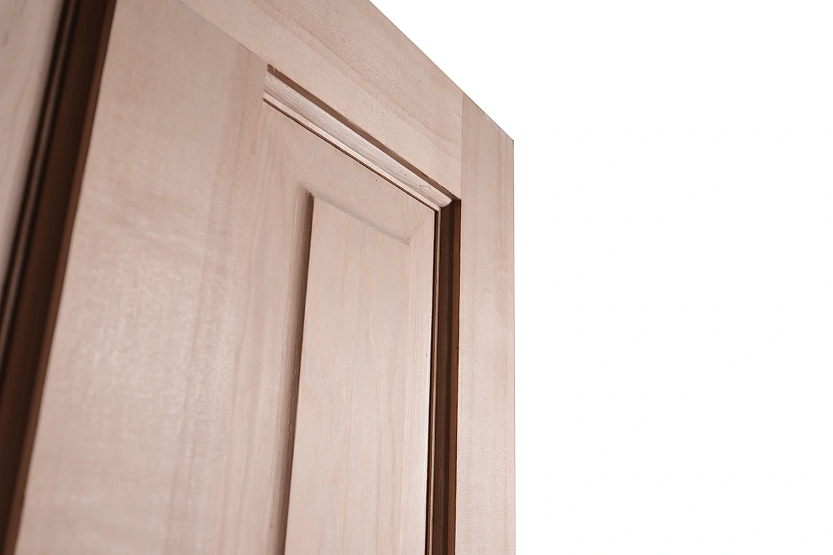 Close-up texture of natural solid Alder wood grain and recessed panel surface