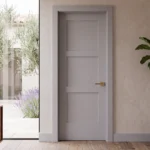 Classic Equal 3-Panel Shaker interior door in Zurich White installed in an airy Crate and Barrel style dining room