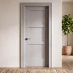 Classic Equal 3-Panel Shaker interior door in Zurich White styled in a warm West Elm aesthetic living room