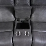 Close-up of open flip-top center storage compartment inside console.