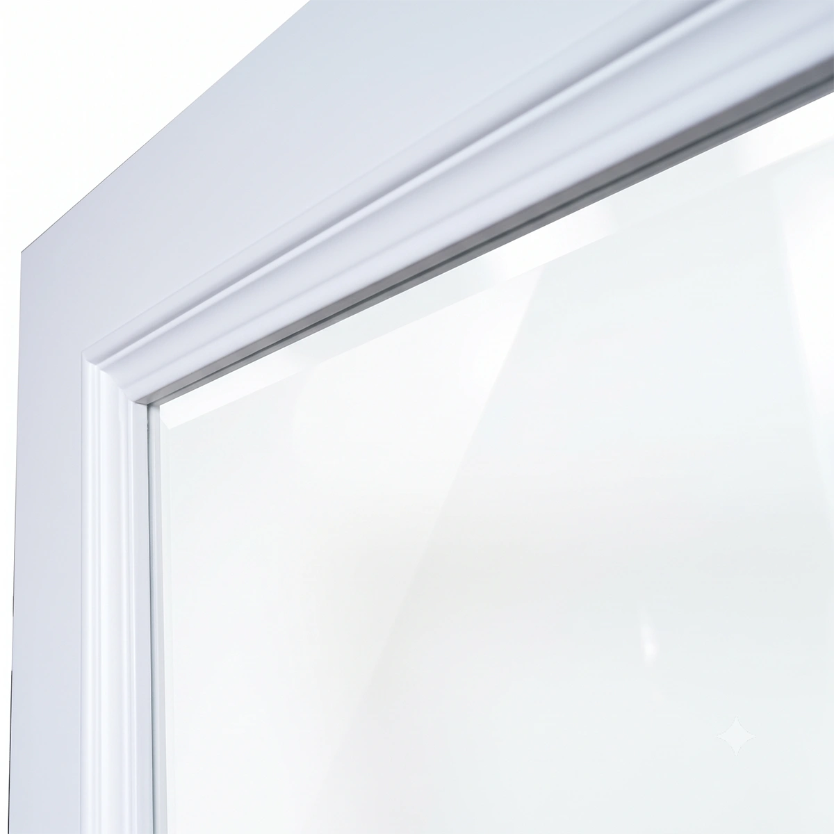 Close-up of projecting bolection moulding shadow lines framing clear tempered safety glass in Dover White