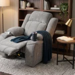 3D lifestyle rendering of Garrison charcoal grey power recliner in a modern home theater media room.