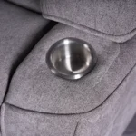 Close-up of dual recessed stainless steel cup holders built into armrests.
