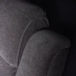 Close-up of channeled overstuffed backrest and plush headrest cushion.