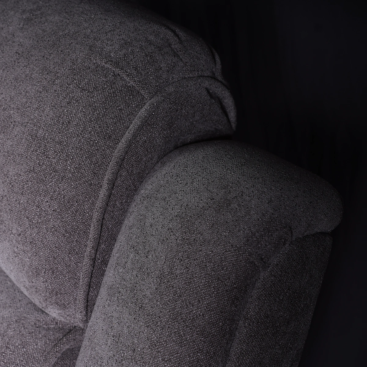 Close-up of channeled overstuffed backrest and plush headrest cushion.