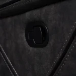 Close-up of exterior recessed manual pull-tab recline release mechanism on side panel.