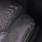 Close-up view of channeled ergonomic backrest cushion providing lumbar and cervical support.