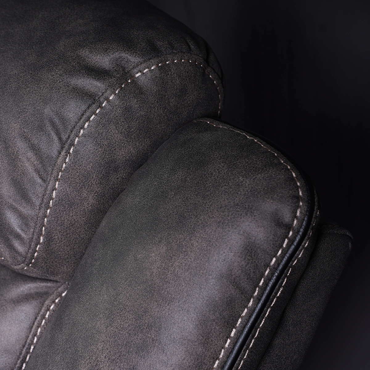 Close-up view of channeled ergonomic backrest cushion providing lumbar and cervical support.