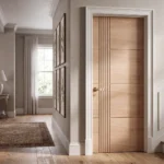 Modern Asymmetrical Reeded & Panel interior door installed in a luxury Japandi minimalist bedroom