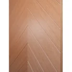 Macro close-up of center V-shaped chevron bookmatch seam on Nordic Wheat Oak veneer