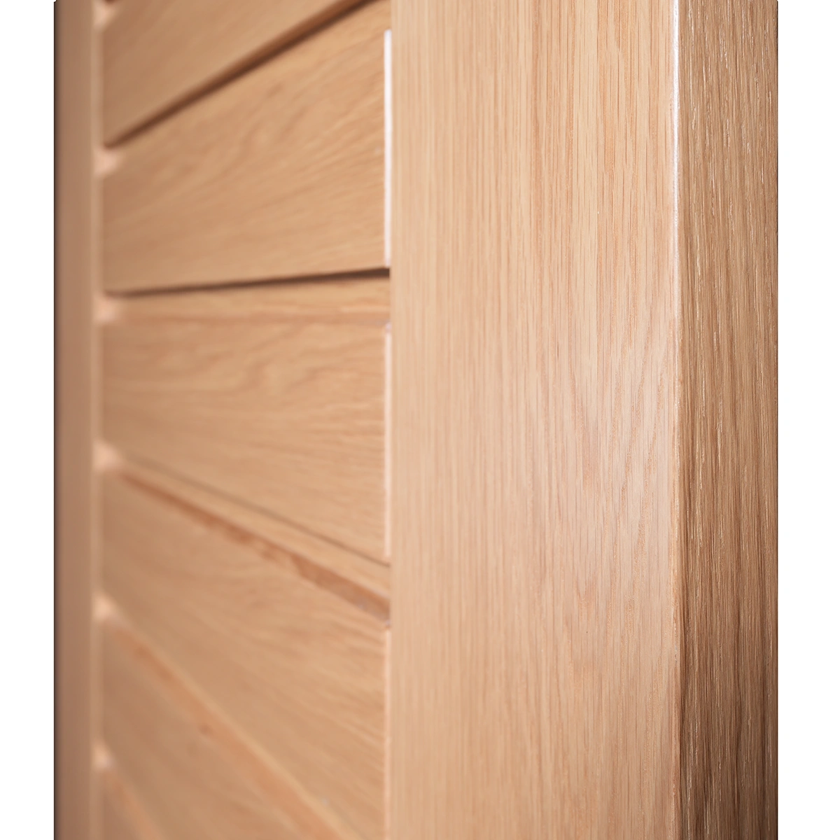 Macro close-up of horizontal CNC reveal groove and open-grain white oak texture