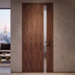 Modern Full-Height Offset 1-Lite door in Heritage Smoked Walnut installed in an executive master suite