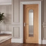 Modern Roman Arch 1-Lite interior glazed door installed in a luxury transitional dining room setting