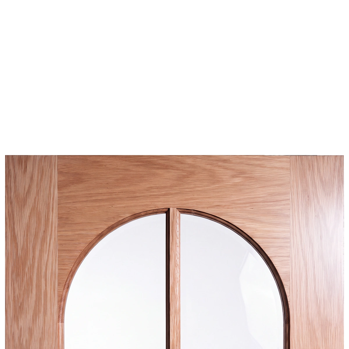 Close-up of upper curved Roman arch crown and tempered glass seating on modern interior door