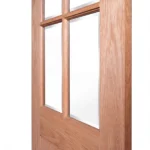 Macro close-up of 4-lite muntin bar intersection and horizontal lock rail transitioning to vertical planks