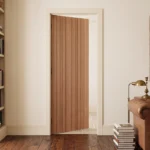 Modern Vertical Slat White Oak interior door installed in a luxury minimalist living space