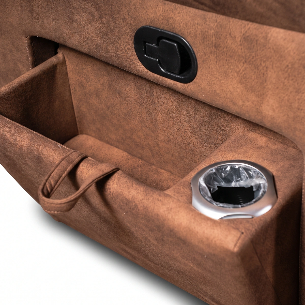 Close-up of deep side storage pocket on Montana distressed leather power recliner sofa holding magazines and remotes.