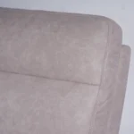 Close-up of plush backrest cushion tailored in taupe beige suede-feel eco-leather.