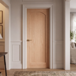 1-panel arch top Nordic Oak interior slab door installed in a modern minimalist living room setting